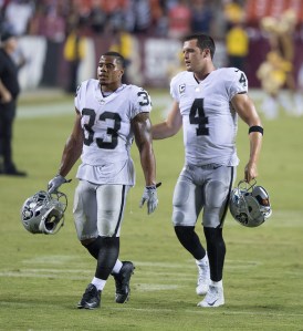 DeAndre Washington, Derek Carr by Ketih Allsion licensed under CC BY-SA 2.0